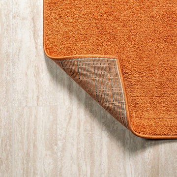 Haze Solid Low-pile Area Rug Orange